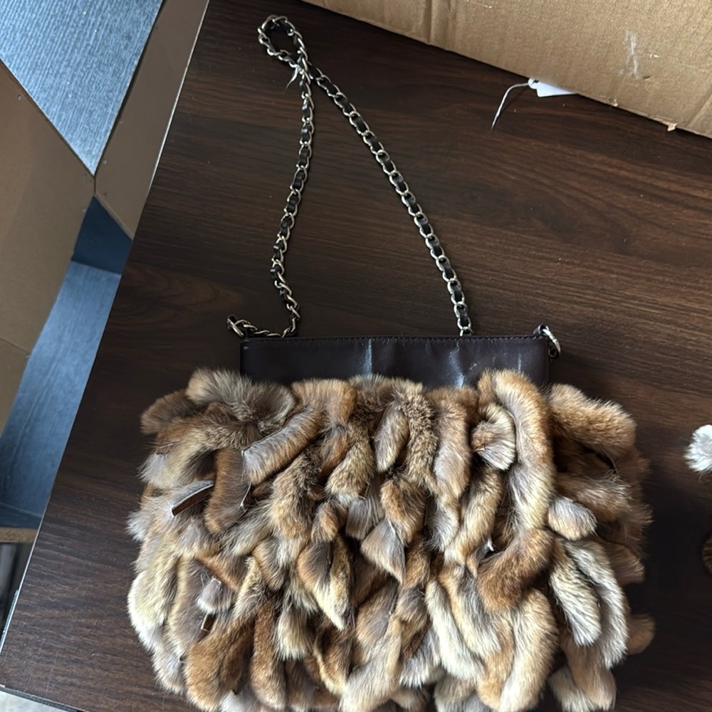Cedric’s fringy rabbit fur mini handbag